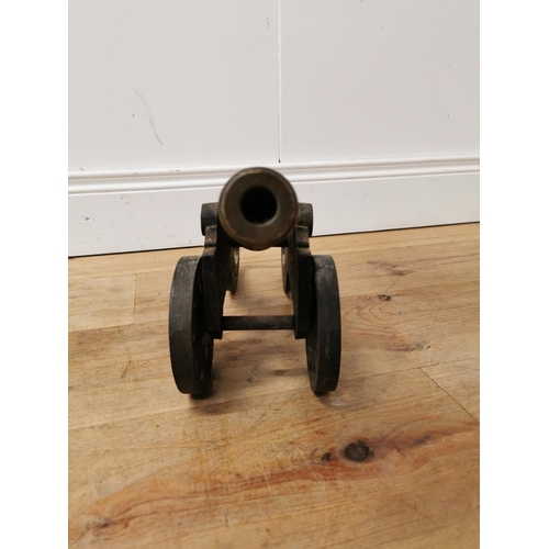 610 - 19th C. brass and cast iron desk cannon {22 cm H x 47 cm W x 14 cm D}.