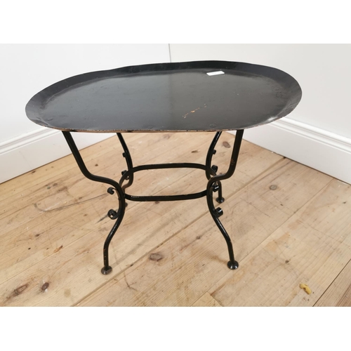 615 - Early 20th C. wrought iron lamp table on four outswept feet. {43 cm H x 53 cm W x 38 cm D}.