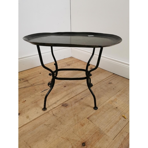 615 - Early 20th C. wrought iron lamp table on four outswept feet. {43 cm H x 53 cm W x 38 cm D}.