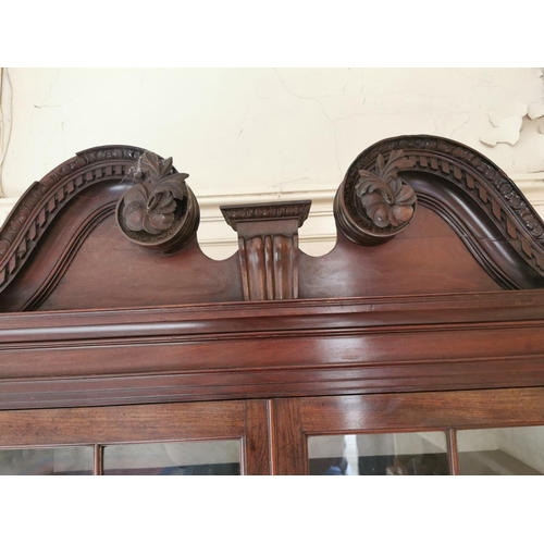 628 - Georgian mahogany bookcase, the swan necked pediment above two astragal glazed doors over two blind ... 