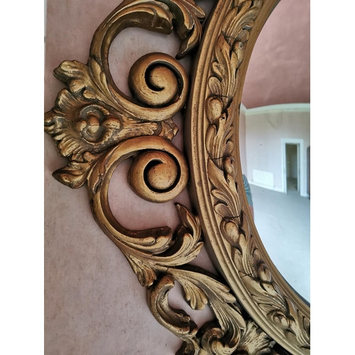 635 - Decorative carved giltwood convex wall mirror in the 19th. C.  style {85 cm Dia.}.