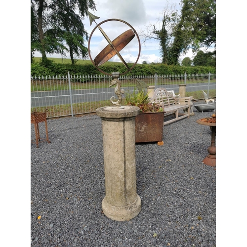 636 - Armorial sundial mounted on composition pedestal {185 cm H x 42 cm Dia.}.