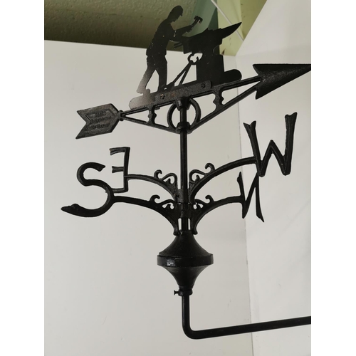 64 - Cast Iron weather vane surmounted with a Blacksmith {62cm H x 32cm W x 59cm D}