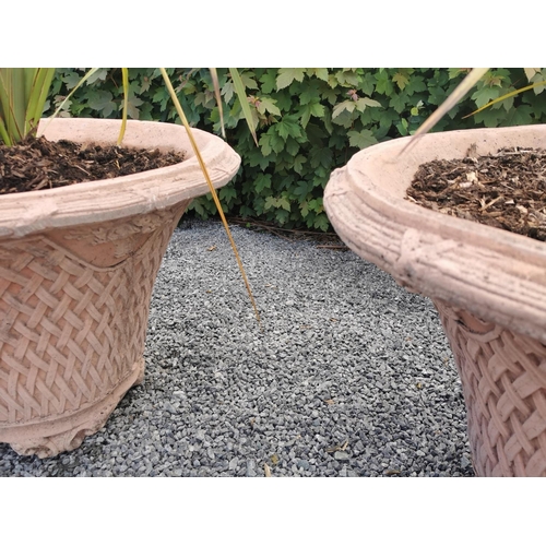 646 - Exceptional pair of moulded terracotta circular planters with basket weave design. {74 cm H x 100 cm... 