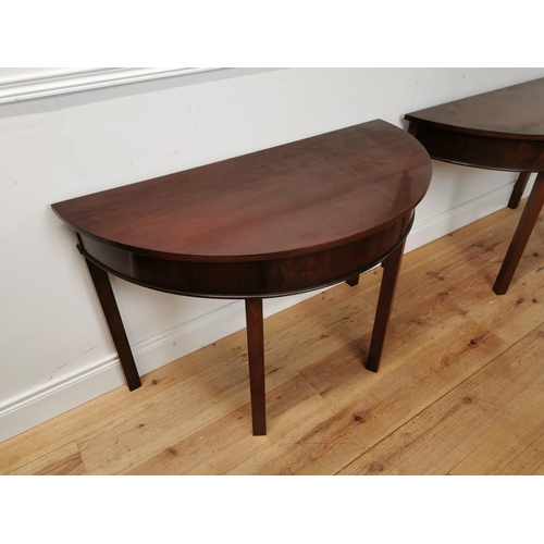 65 - Pair of Georgian mahogany demi-lune side tables raised on square legs {73 cm H x 114 cm W x 54 cm D}... 