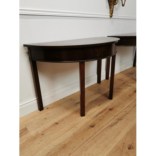 65 - Pair of Georgian mahogany demi-lune side tables raised on square legs {73 cm H x 114 cm W x 54 cm D}... 