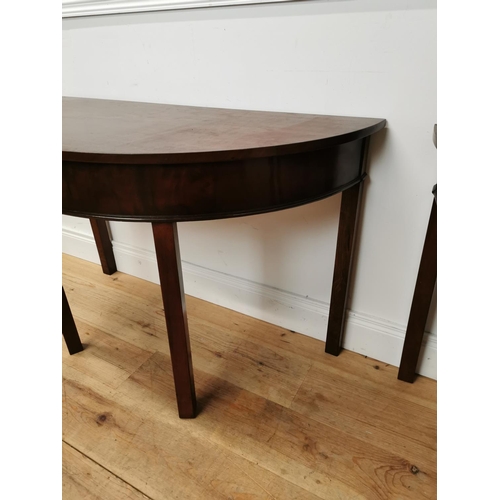 65 - Pair of Georgian mahogany demi-lune side tables raised on square legs {73 cm H x 114 cm W x 54 cm D}... 