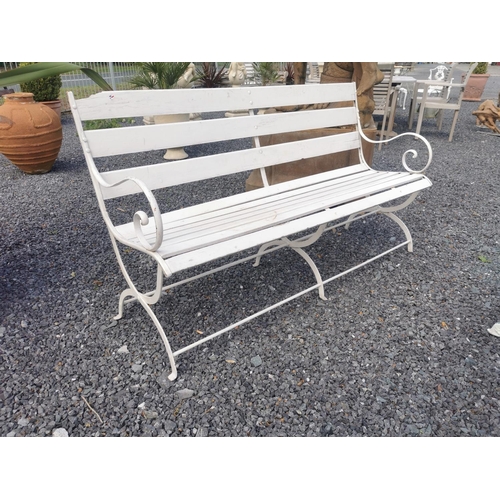 651 - Wrought iron and wooden garden bench {84 cm H x 150 cm W x 56 cm D}.