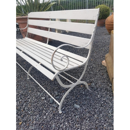 651 - Wrought iron and wooden garden bench {84 cm H x 150 cm W x 56 cm D}.