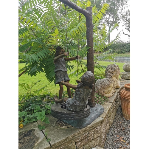 662 - Exceptional quality bronze sculpture of Two Girls on a Swing {145 cm H x 87 cm W x 70 cm D}.