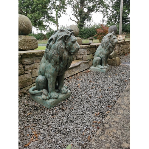 667 - Pair of exceptional quality bronze seated Lions {80 cm H x 42 cm W x 40 cm D}.