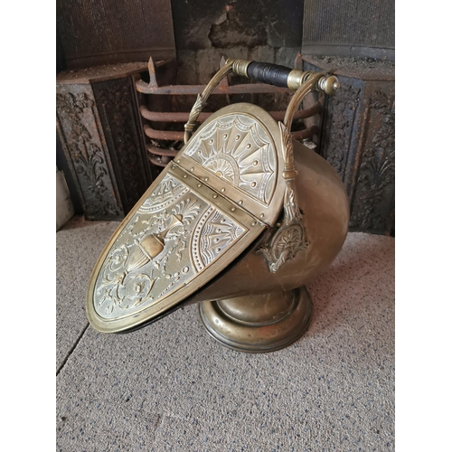 681 - 19th C. embossed brass coal skuttle {50 cm H x 31 cm W x 50 cm D}.