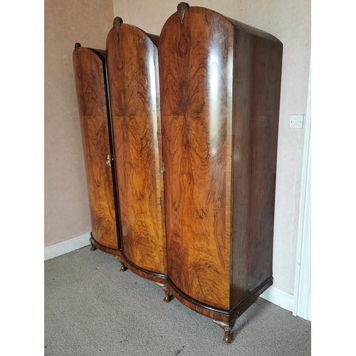 683 - Art Deco veneered walnut three door wardrobe raised on cabriole legs {213 cm H x 183 cm W x 65 cm D}... 