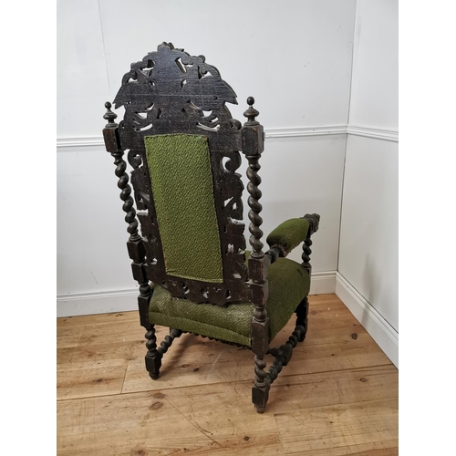 690 - 19th. C. upholstered carved oak throne chair the arms terminating in dog's heads  { 130cm H X 67cm W... 