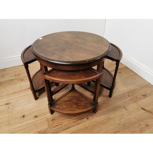 692 - 1950's nest of five walnut tables { 54cm H X 70cm Dia }.