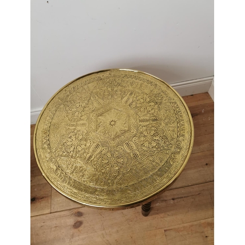 696 - Indian folding table with beaten brass top. { 59cm H X 59cm Dia }