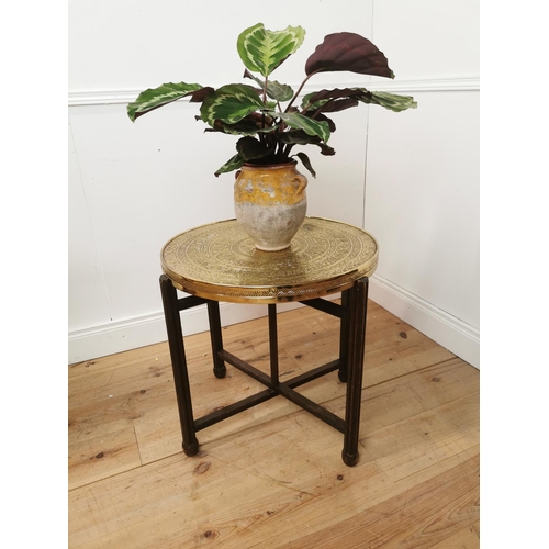 697 - Indian folding table with beaten brass top. { 60cm H X 64cm Dia }