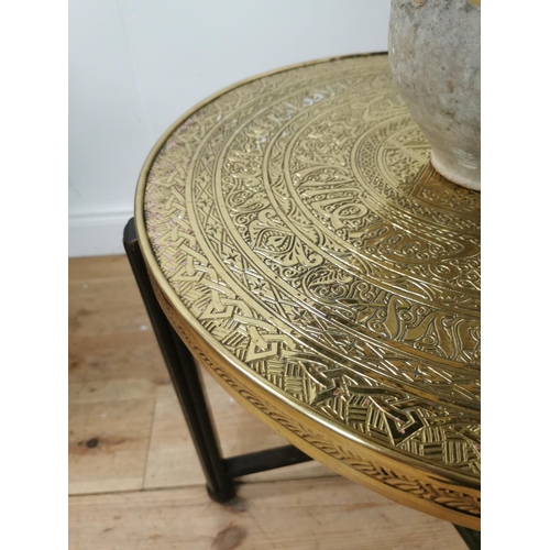 697 - Indian folding table with beaten brass top. { 60cm H X 64cm Dia }