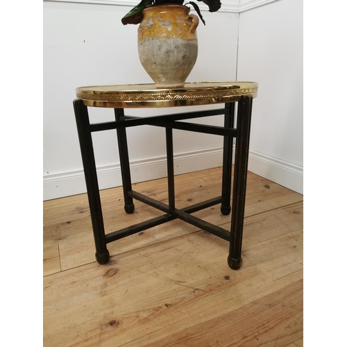 697 - Indian folding table with beaten brass top. { 60cm H X 64cm Dia }