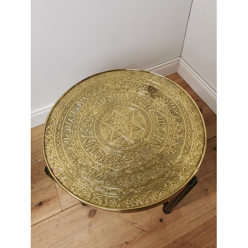 697 - Indian folding table with beaten brass top. { 60cm H X 64cm Dia }