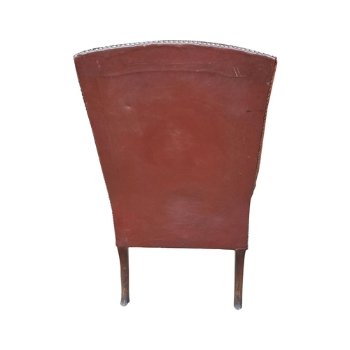 717 - Edwardian leather upholstered wing backed armchair raised on carved mahogany cabriole legs { 104cm H... 