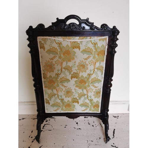 724 - 19th. C. mahogany fire screen the cloth panel flanked by turned columns raised on out swept supports... 