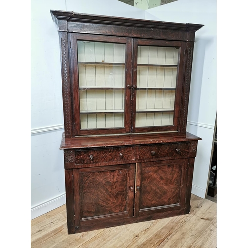 740 - 19th. C. Irish carved and scumbled pine press, the two glazed doors over two short drawers and two b... 