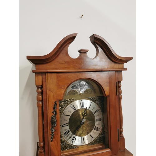 744 - Walnut grandmother clock with brass arched dial and glazed long door { 185cm H X 40cm W  X 25cm D }.