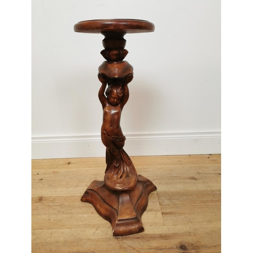 746 - Wood effect resin jardiniere stand decorated with cherubs. { 66 cm H x 32 cm Diam}