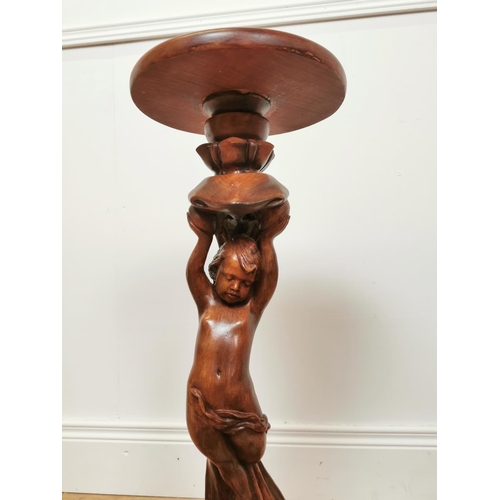 746 - Wood effect resin jardiniere stand decorated with cherubs. { 66 cm H x 32 cm Diam}