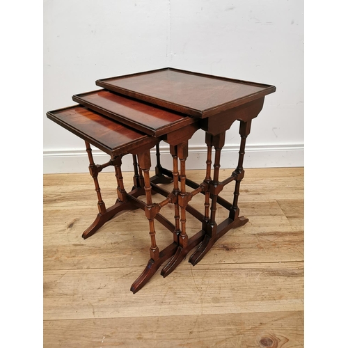 75 - Good quality nest of three mahogany tables raised on turned legs {57 cm H x 50 cm W x 35 cm D}.