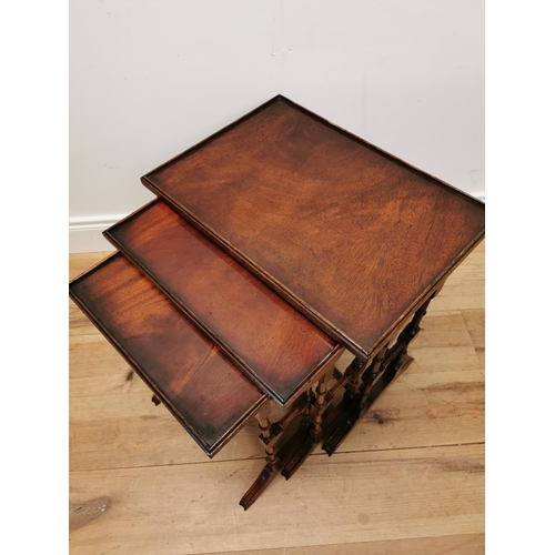 75 - Good quality nest of three mahogany tables raised on turned legs {57 cm H x 50 cm W x 35 cm D}.