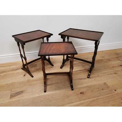 75 - Good quality nest of three mahogany tables raised on turned legs {57 cm H x 50 cm W x 35 cm D}.