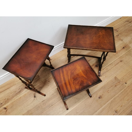 75 - Good quality nest of three mahogany tables raised on turned legs {57 cm H x 50 cm W x 35 cm D}.