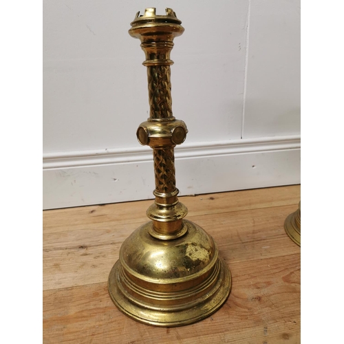 752 - Three 19th. C. brass candlesticks { 63cm H, 40cm H & 13cm H }.