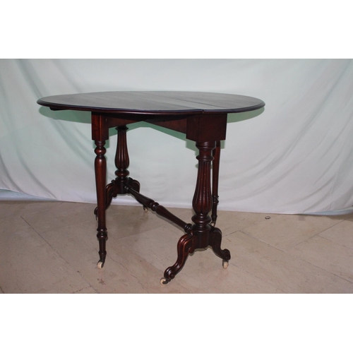 777 - 19th. C. walnut Sutherland table raised on turned supports with outswept feet and turned stretcher {... 