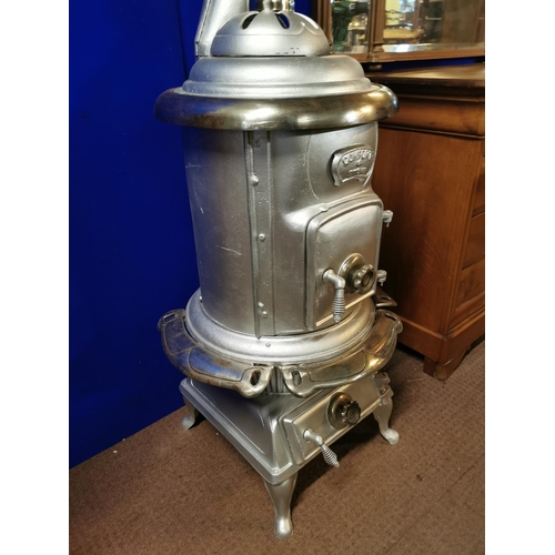 783 - Early 20th. C. cast iron Comfort stove. {190 cm H  x 60 Diam}.