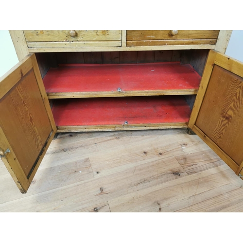 79 - 19th C. Irish pine kitchen dresser with open shelves above two drawers and two blind doors {197 cm H... 