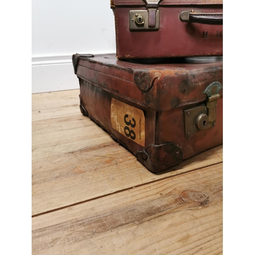 799 - Two early 20th. C. leather suitcases { 17cm H X 66cm W X 38cm D & 15cm H X 45cm W X 32cm D }.