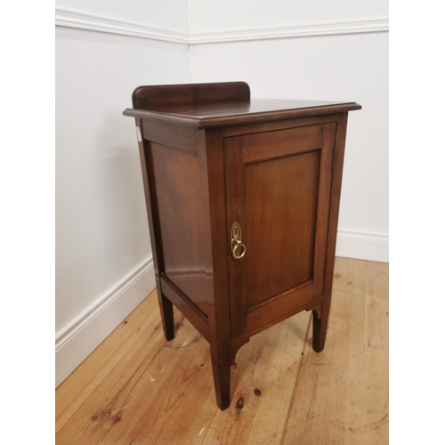 803 - Edwardian mahogany bedside locker the gallery back above a single paneled door raised on tapered squ... 