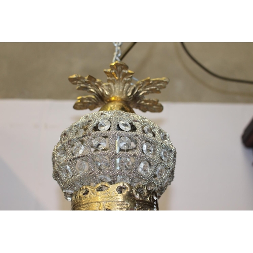 817 - Cut glass and brass six lamp chandelier decorated with floral and mask motifs  { 80cm H X 40cm Dia }... 