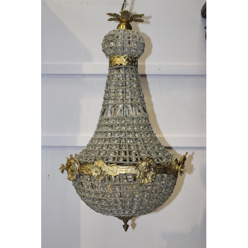 817 - Cut glass and brass six lamp chandelier decorated with floral and mask motifs  { 80cm H X 40cm Dia }... 