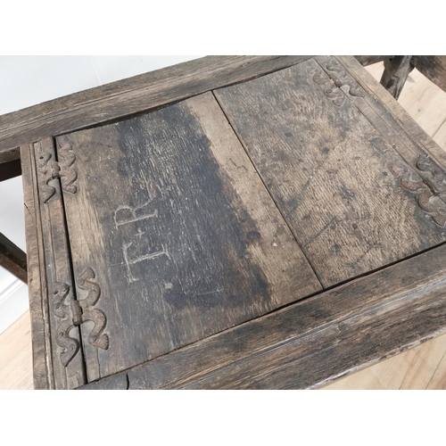 843 - Rare 17th. C. oak bible table the two doors in the centre panel with metal fittings and inscribed T+... 