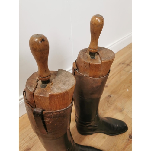 845 - Pair of 19th. C. leather riding boots with wooden trees { 65cm H X 31cm W X 10cm D }.