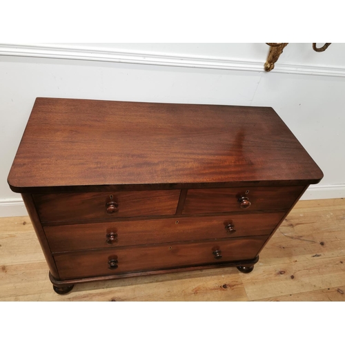 85 - 19th. C. mahogany chest of drawers with two short drawers over two long drawers raised on bun feet {... 