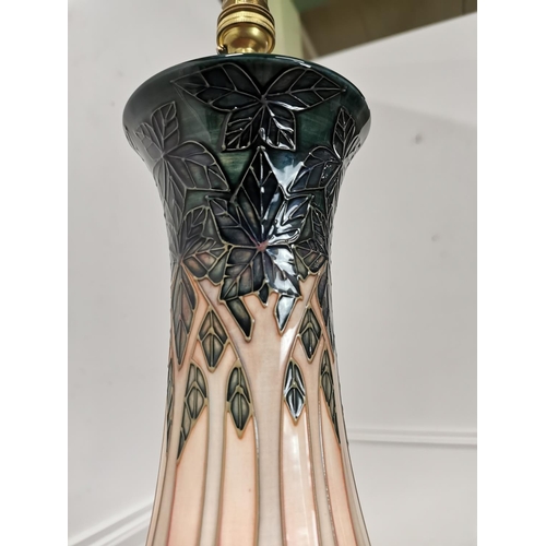 861 - Moorcroft Tree pattern pottery table lamp mounted on wooden base. { 43cm H X 18cm Dia }.