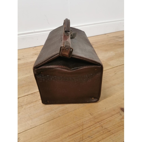 885 - Early 20th. C. leather Gladstone bag { 30cm H X 51cm W X 26cm D }.