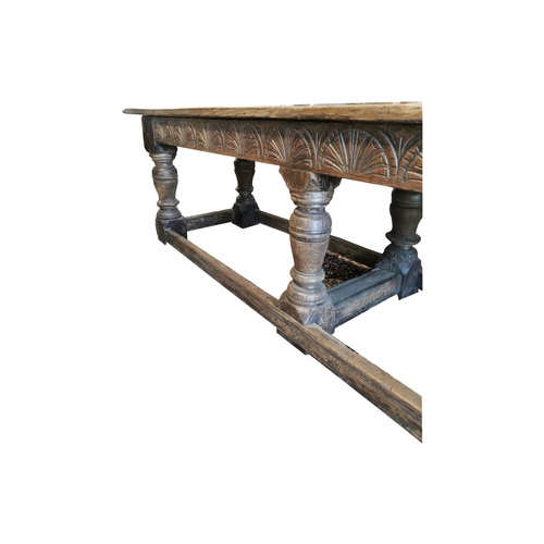 894 - 17th. C. oak refectory table with carved frieze and raised on turned bulbous legs and stretchers { 8... 