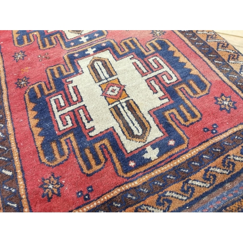 929 - Persian100% wool hand knotted rug { 144cm L X 86cm W }.