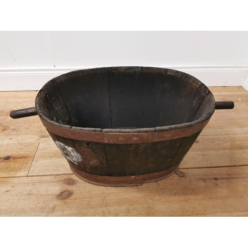 931 - Early 20th. C. oak metal bound log bucket { 30cm H X 80cm W X 40cm D }.